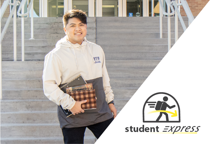 B Y U - Idaho Male Student with books in hand. Wearing a cream and grey B Y U - I hoodie